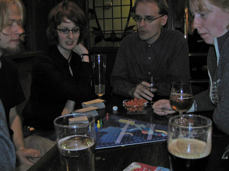 Playing a board game and having some nuts