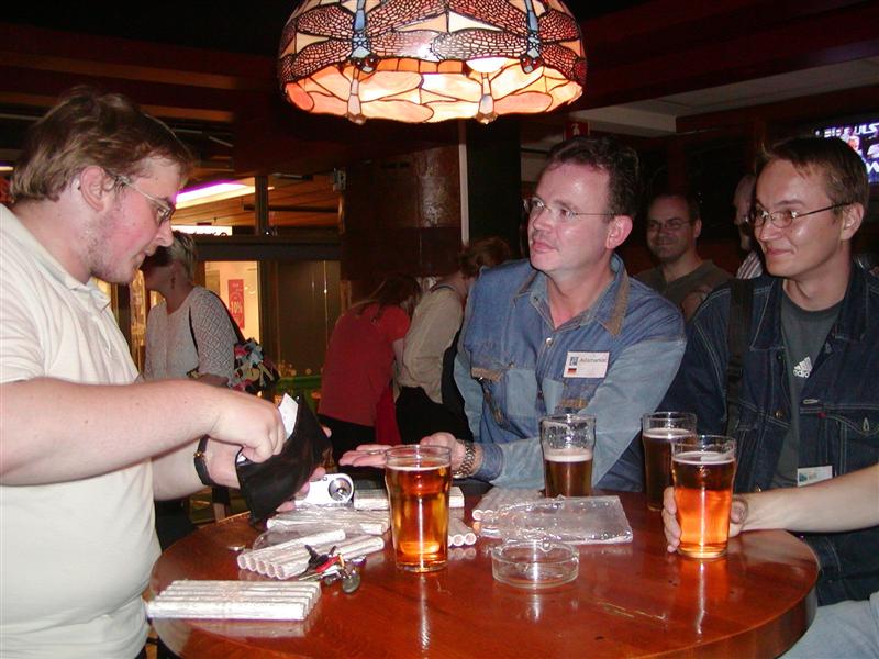 Inside Sports Academy Cafe, Osku^, Asiamaniac and aplfi. On the table rolls of new coins. And beer!