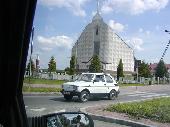 A Polski Fiat in front of one of many modern churches in Poland.