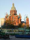 The red Uspenski Cathedral lits up in the eveningsun.