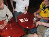 Next bar.. We borrowed a deck of cards from pooca, as we had to wait a while before our bus to Helsinki would leave. It was rather dark in that corner of the bar, and it was slightly difficult to differentiate between blue and green cards. Cell phones were a valuable light source ;)