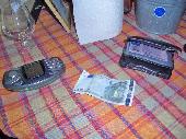The triple hit note, the device used to enter it, and the storage tool for it.