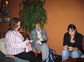 Cinnamon and imleH entering some notes, Venlis toying with her phone