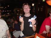 Elmo showing the money that he won with blackjack.