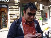 TRINACRIA is playing with his mobile phone.