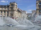 A refreshing fountain in the hot citycentre of M&uuml;nchen. The Karlstor in the background.