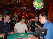 Elmo, aplfi and Osku^ playing at the blackjack table in caf� Hemingway�s. Prynde watching.