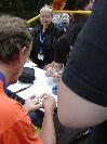 Yli~, Luise and Onkelolf looking at interesting coins.