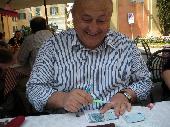 president was writing down serial of his notes whil we was waiting our meal. You can notice presidente uses a hand lens to read the short code :D